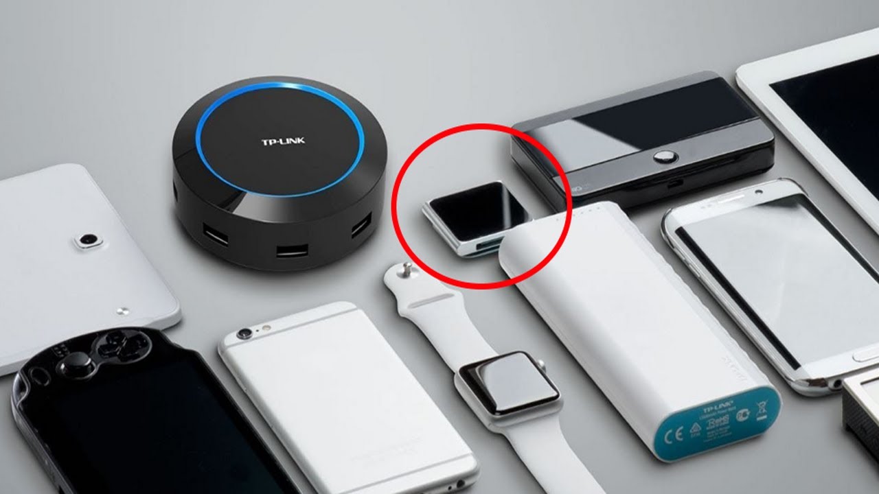 Collection of electronic devices including a smartwatch, power bank, and router on a light gray background.